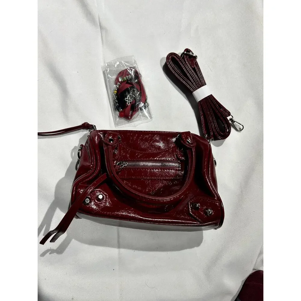 NWOT Deep Red Vegan Leather Handbag with Crossbody Strap and‎ Bag charms